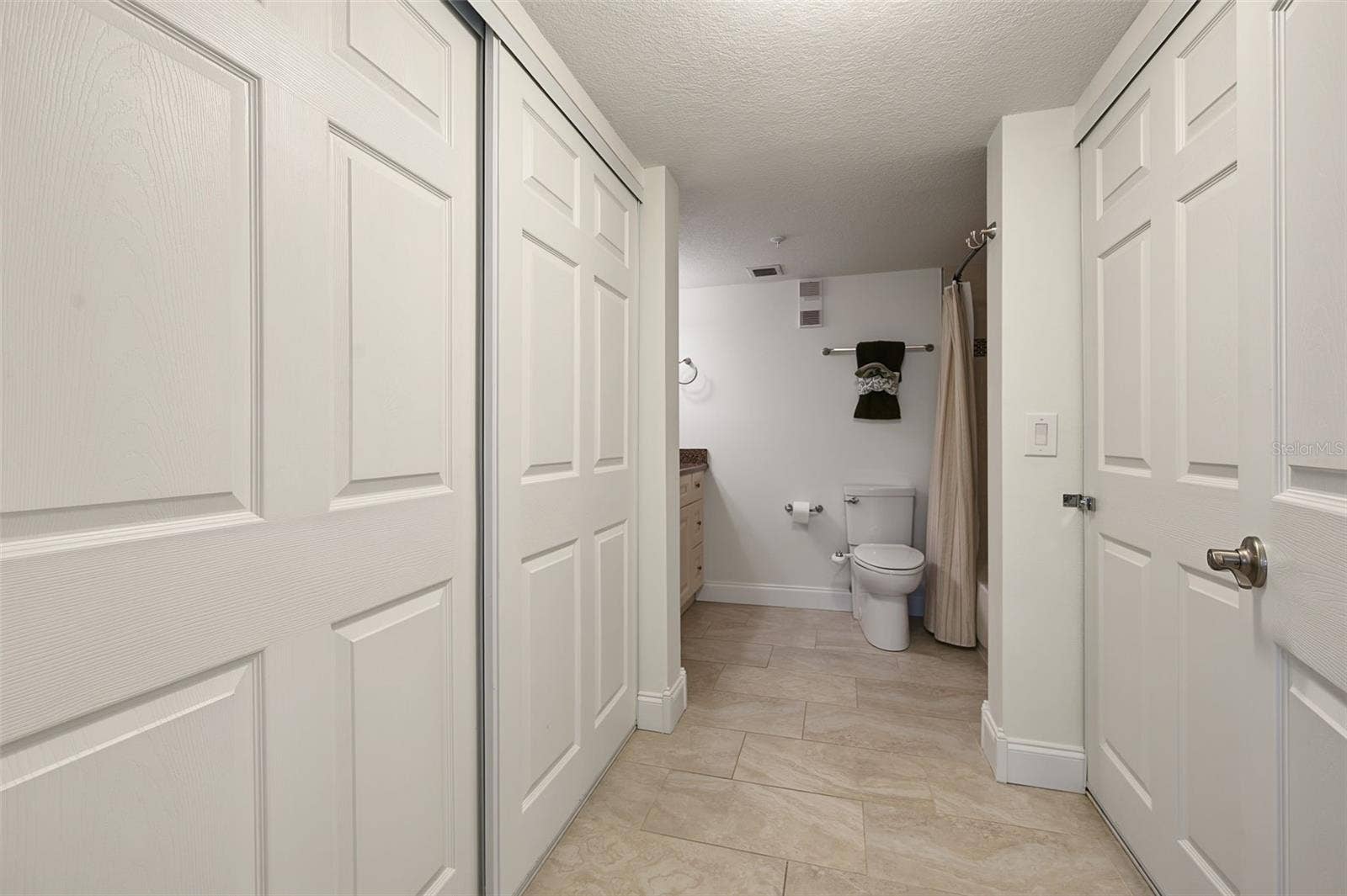 19531 GULF BOULEVARD, #604, Indian Shores, FL 33785 Primary bedroom walk-in closets - leading into the Bathroom