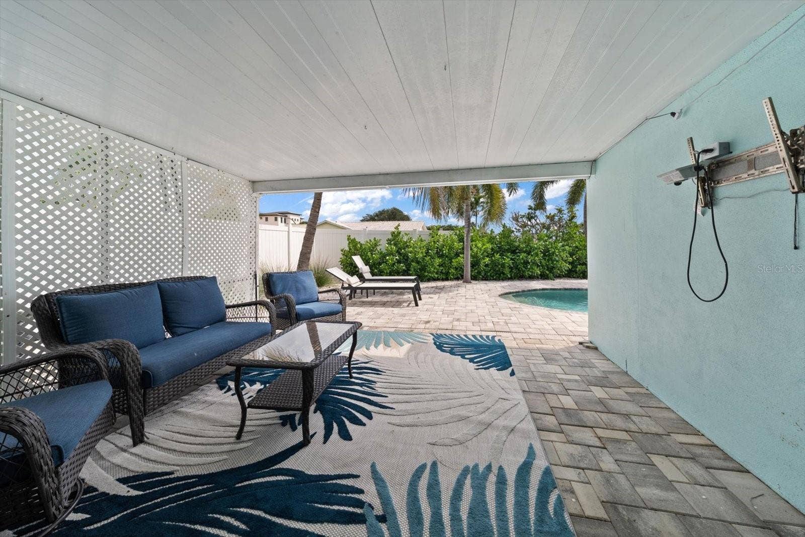 650 64TH AVENUE, St Pete Beach, FL 33706 Large Covered Patio Outside the Primary Bedroom