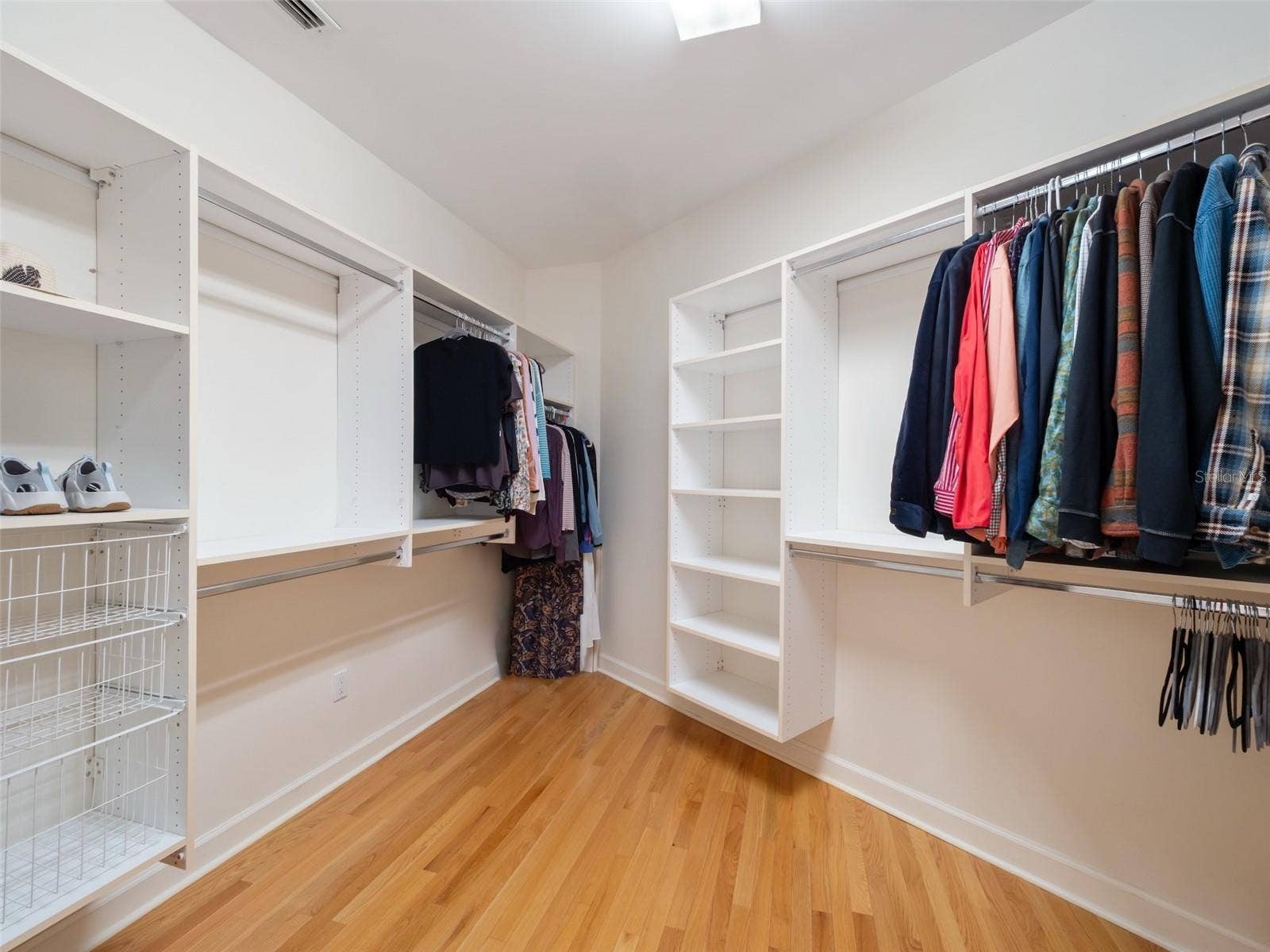 Customized walk in closet in Primary