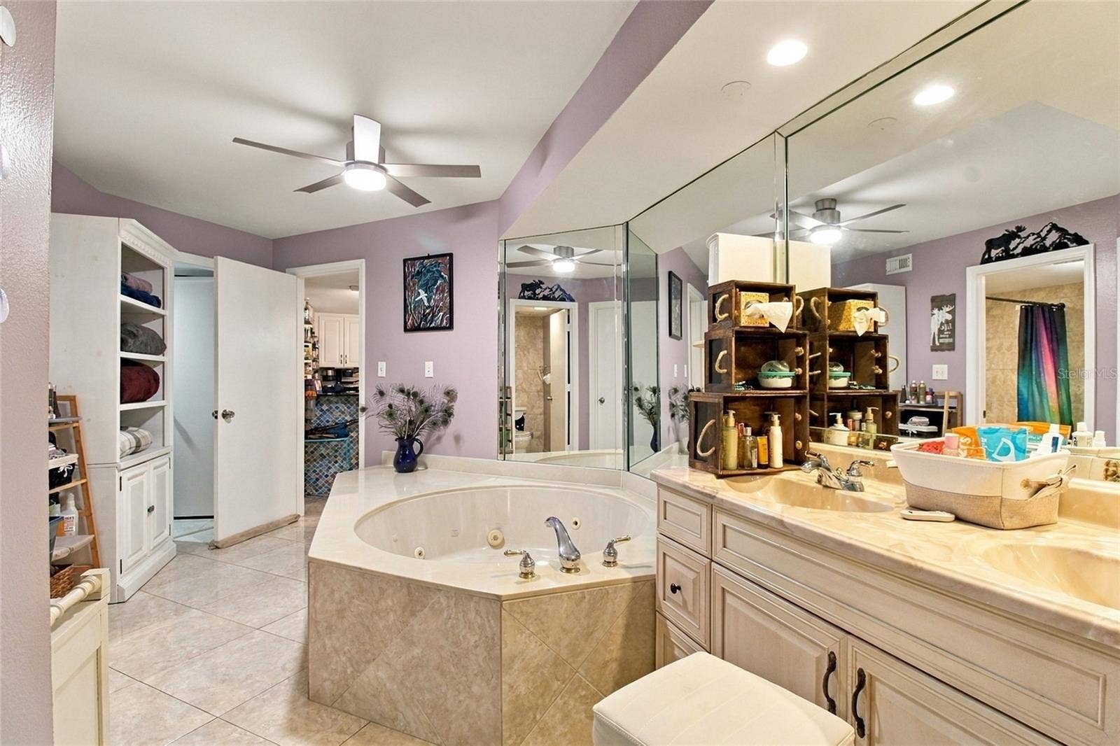 2511 DOLLY BAY DRIVE, #104, Palm Harbor, FL 34684 Primary Ensuite Bath - two walk-in closets and linen closet