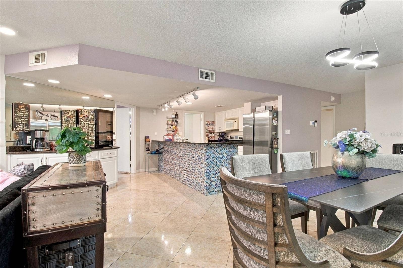 2511 DOLLY BAY DRIVE, #104, Palm Harbor, FL 34684 Dining Room into Open Concept LR, Kitchen