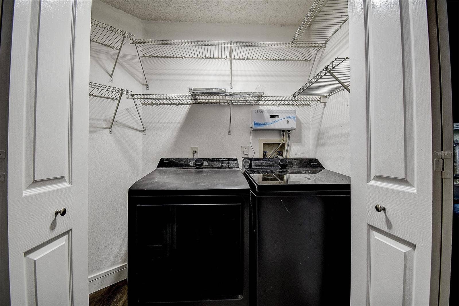 1709 SCOTCH PINE DRIVE, Brandon, FL 33511 Laundry Closet in hallway near 2nd bath