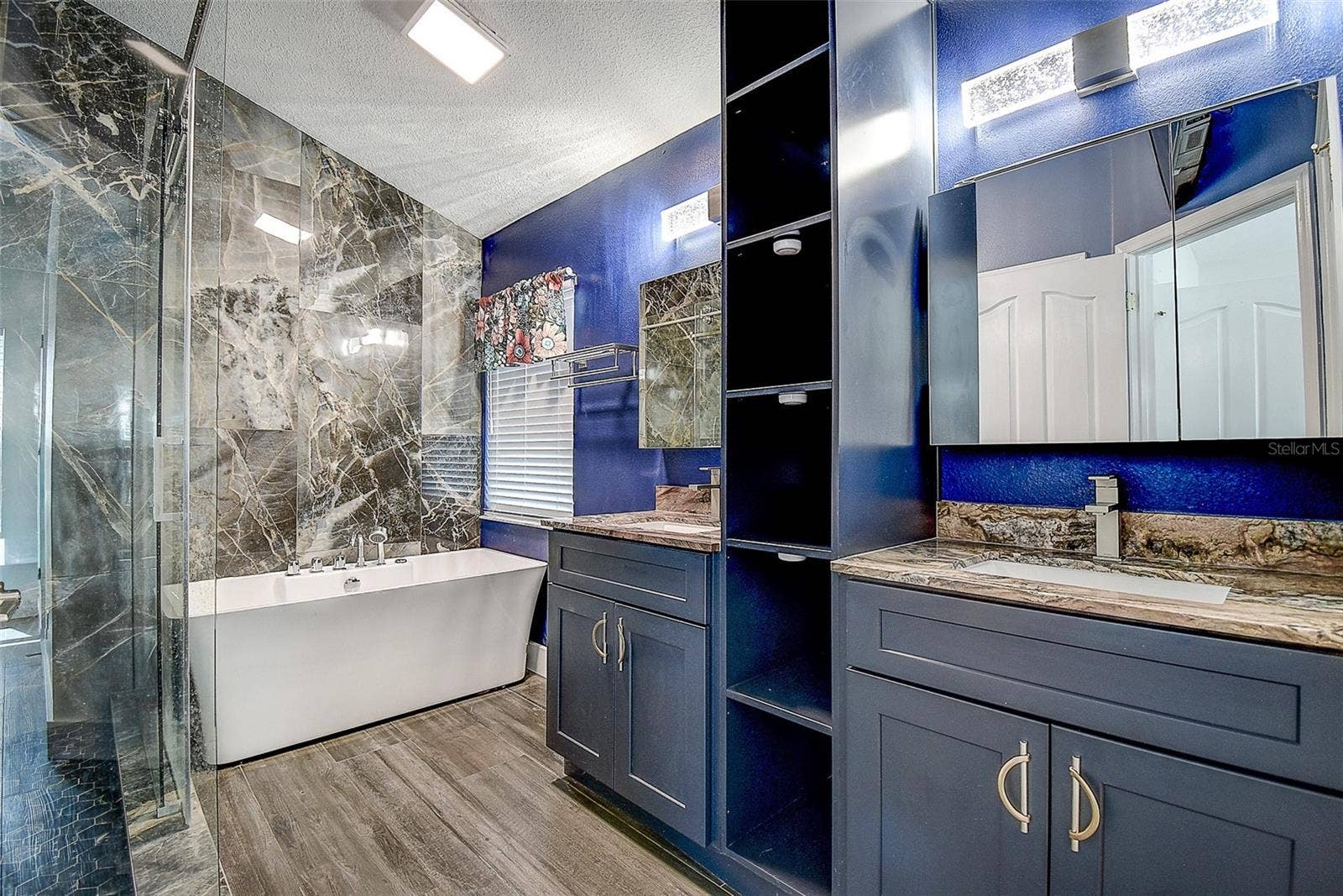 1709 SCOTCH PINE DRIVE, Brandon, FL 33511 Large Spa tub and dual vanities with granite and wood cabinetry