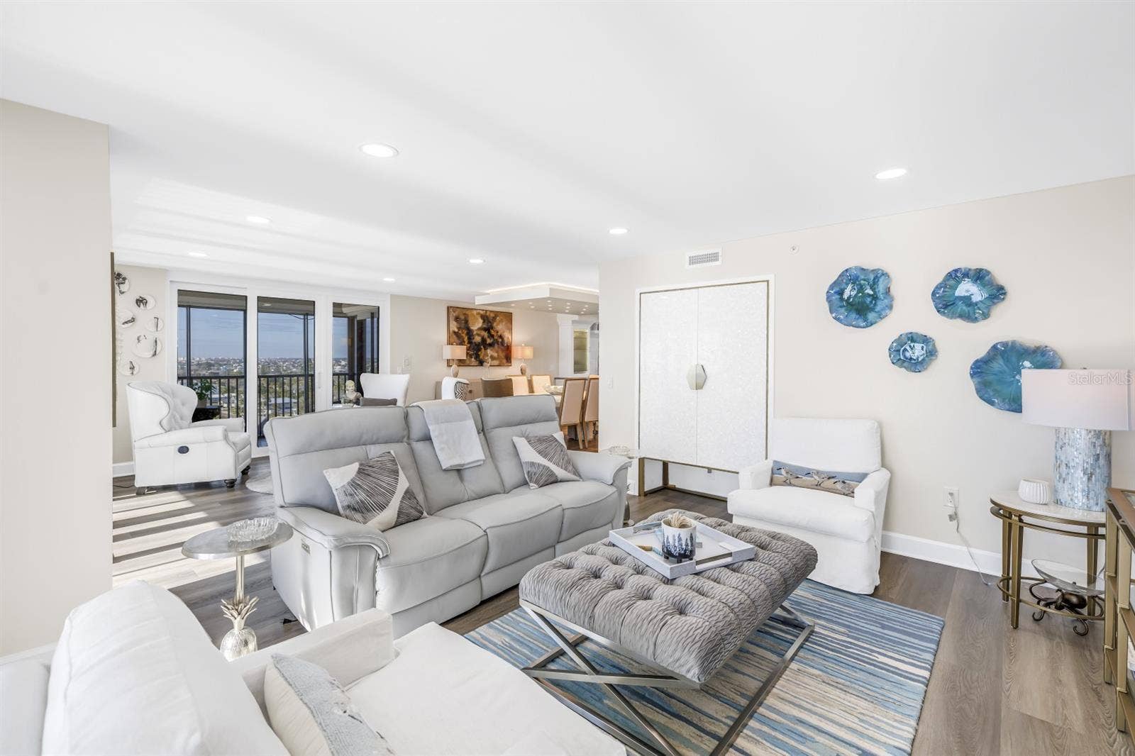 Family Room Features Custom Mother of Pearl Bar Cabinet