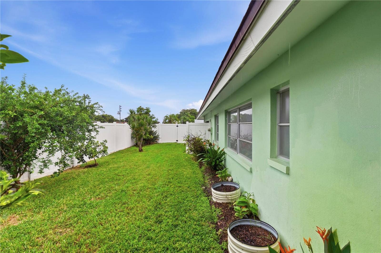 10211 139TH STREET, Largo, FL 33774 side yard with fruit trees