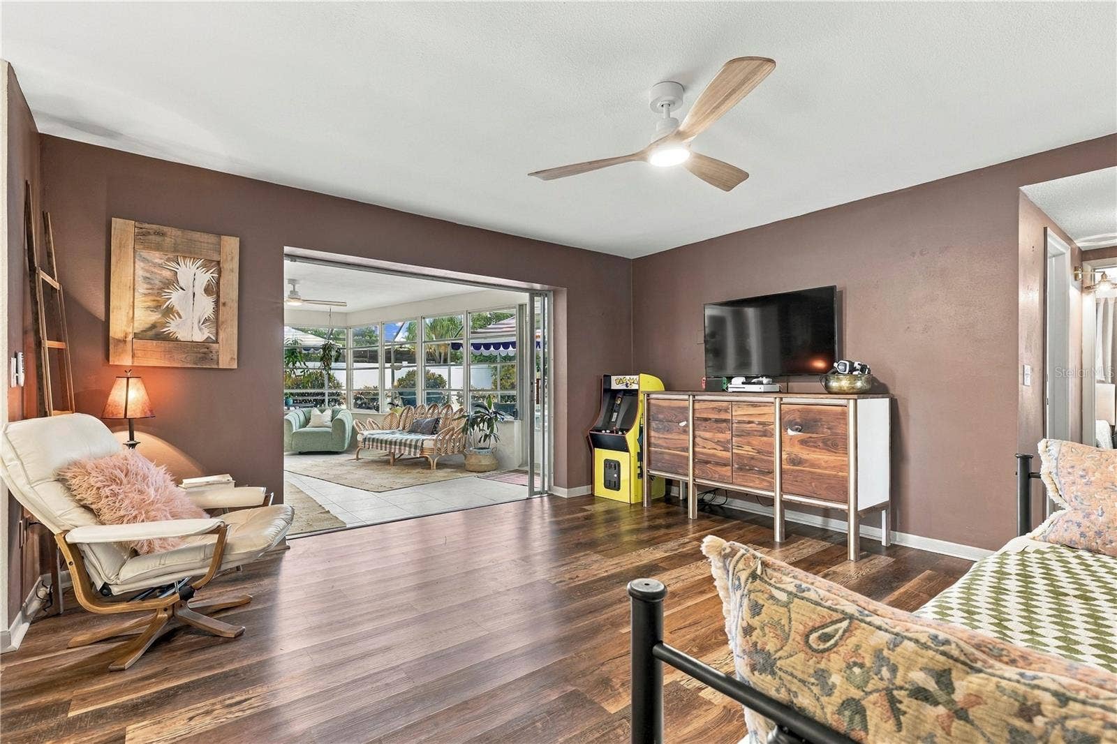 10211 139TH STREET, Largo, FL 33774 Family room open to sun room