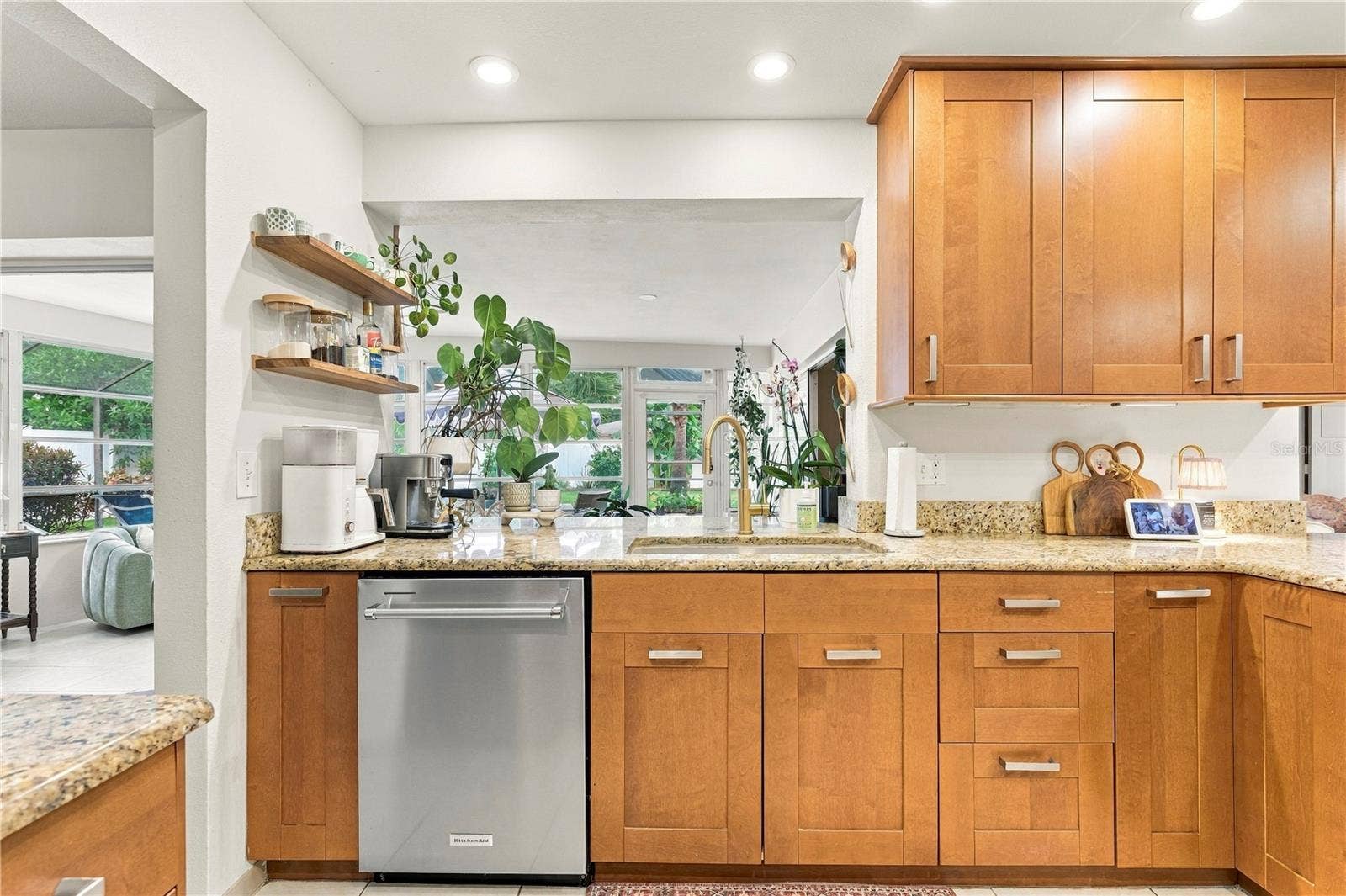 10211 139TH STREET, Largo, FL 33774 Kitchen overlooking sun room to back patio and pool