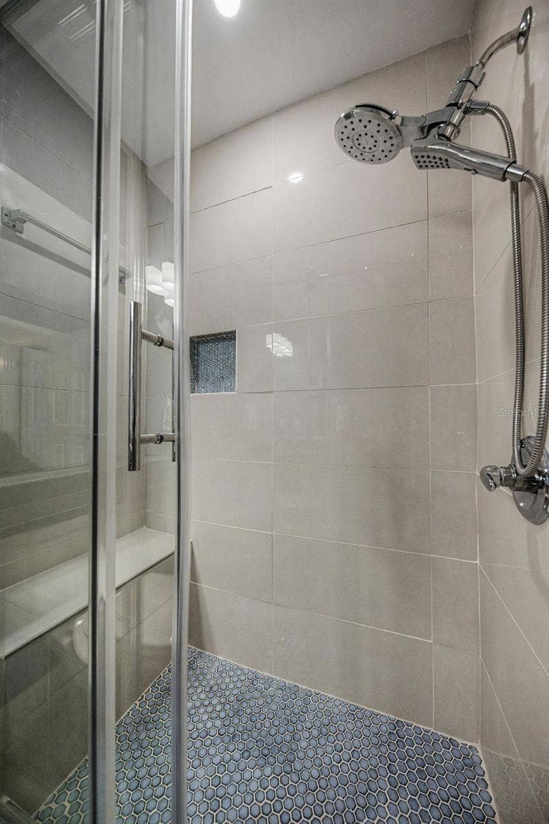 1801 E LAKE ROAD, #1D, Palm Harbor, FL 34685 Shower in Guest Bathroom