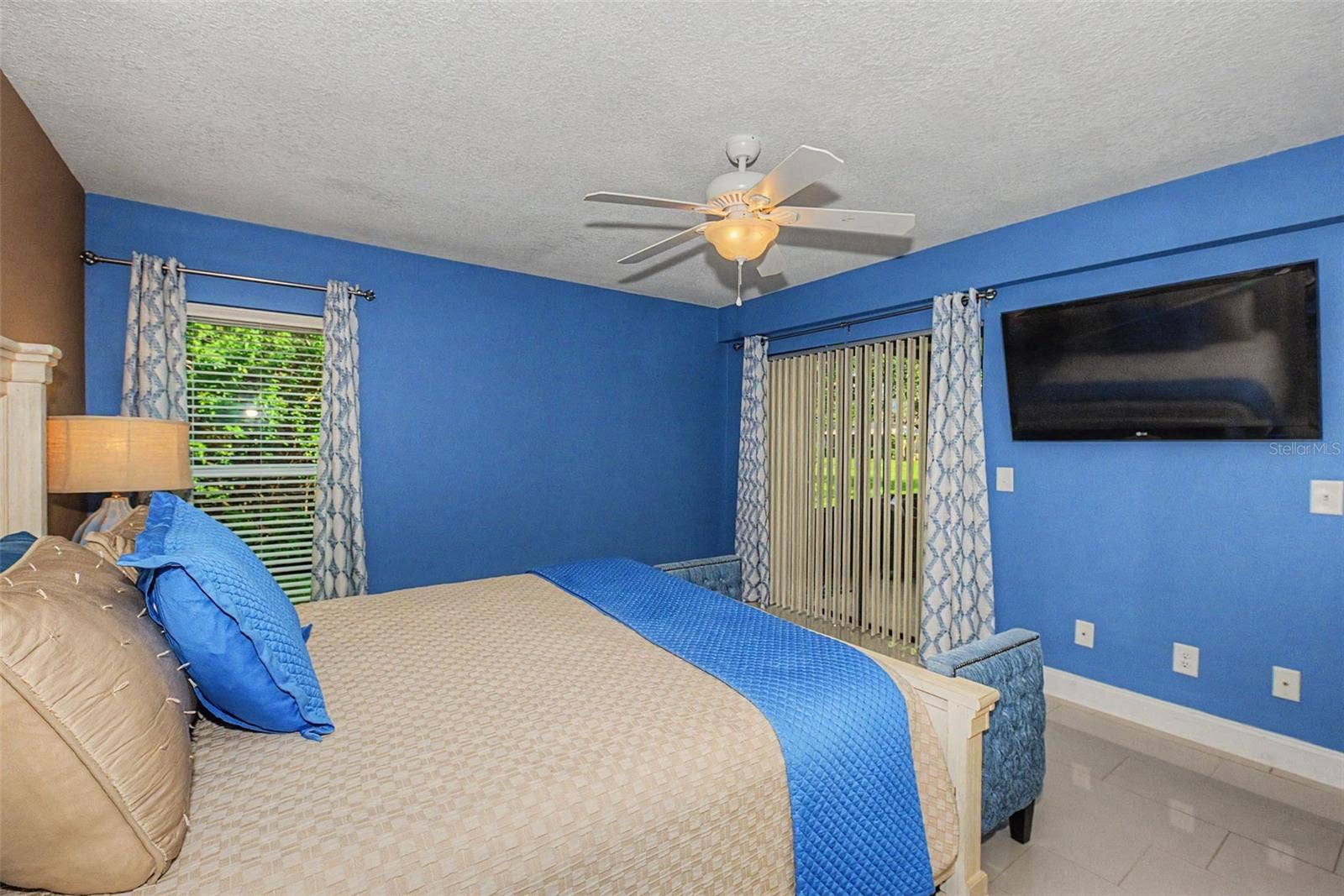 1801 E LAKE ROAD, #1D, Palm Harbor, FL 34685 Primary Bedroom w/slider to Florida Room