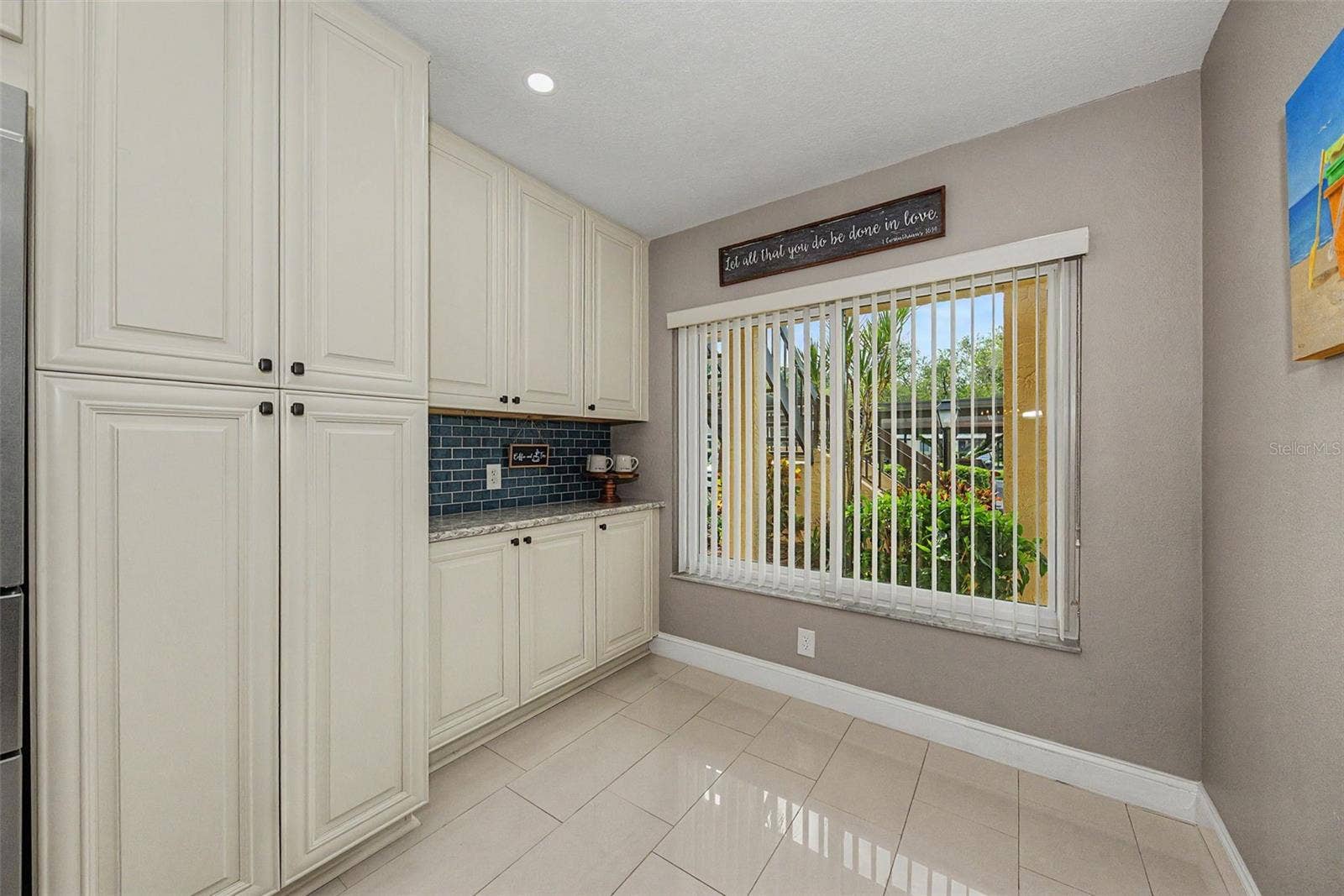 1801 E LAKE ROAD, #1D, Palm Harbor, FL 34685 Kitchen with pantry cabinet and pull-out drawers