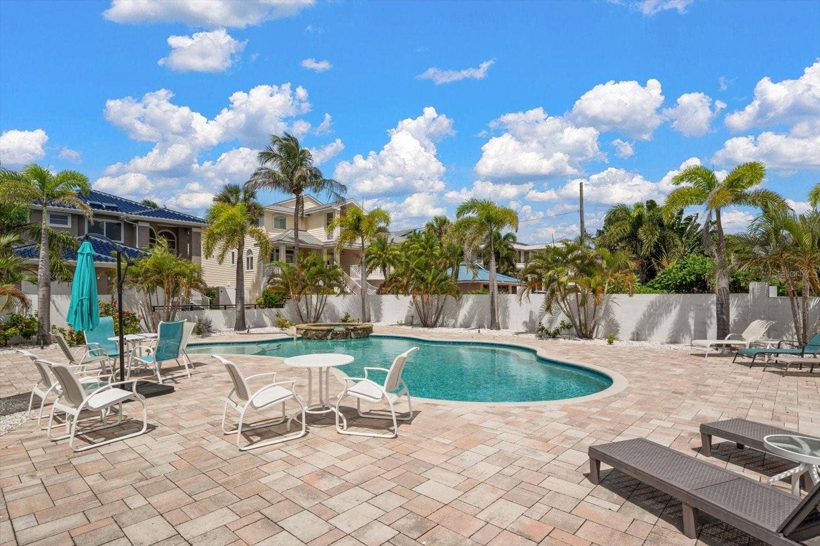 Pool is surrounded by lots of area to relax and enjoy.