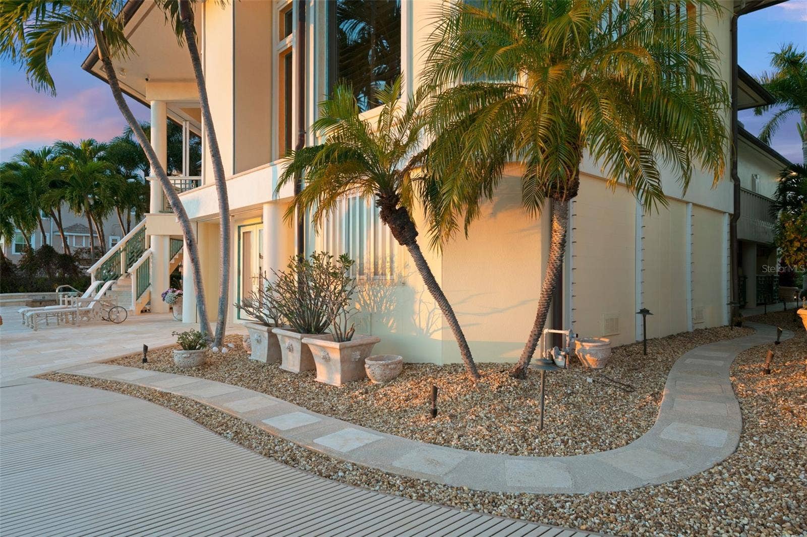 964 MONTE CRISTO BOULEVARD, Tierra Verde, FL 33715 Sidewalk to the Pool Equipment and to the Gate to the front yard.