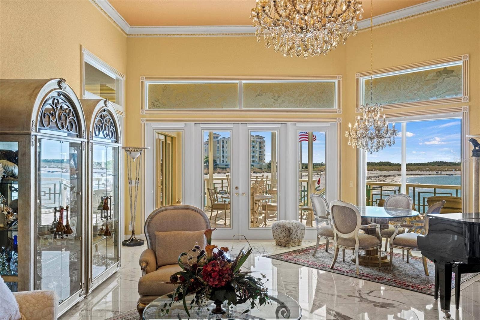 964 MONTE CRISTO BOULEVARD, Tierra Verde, FL 33715 Formal Living Room with Marble Floors and French Doors to the Upper Level Lanai