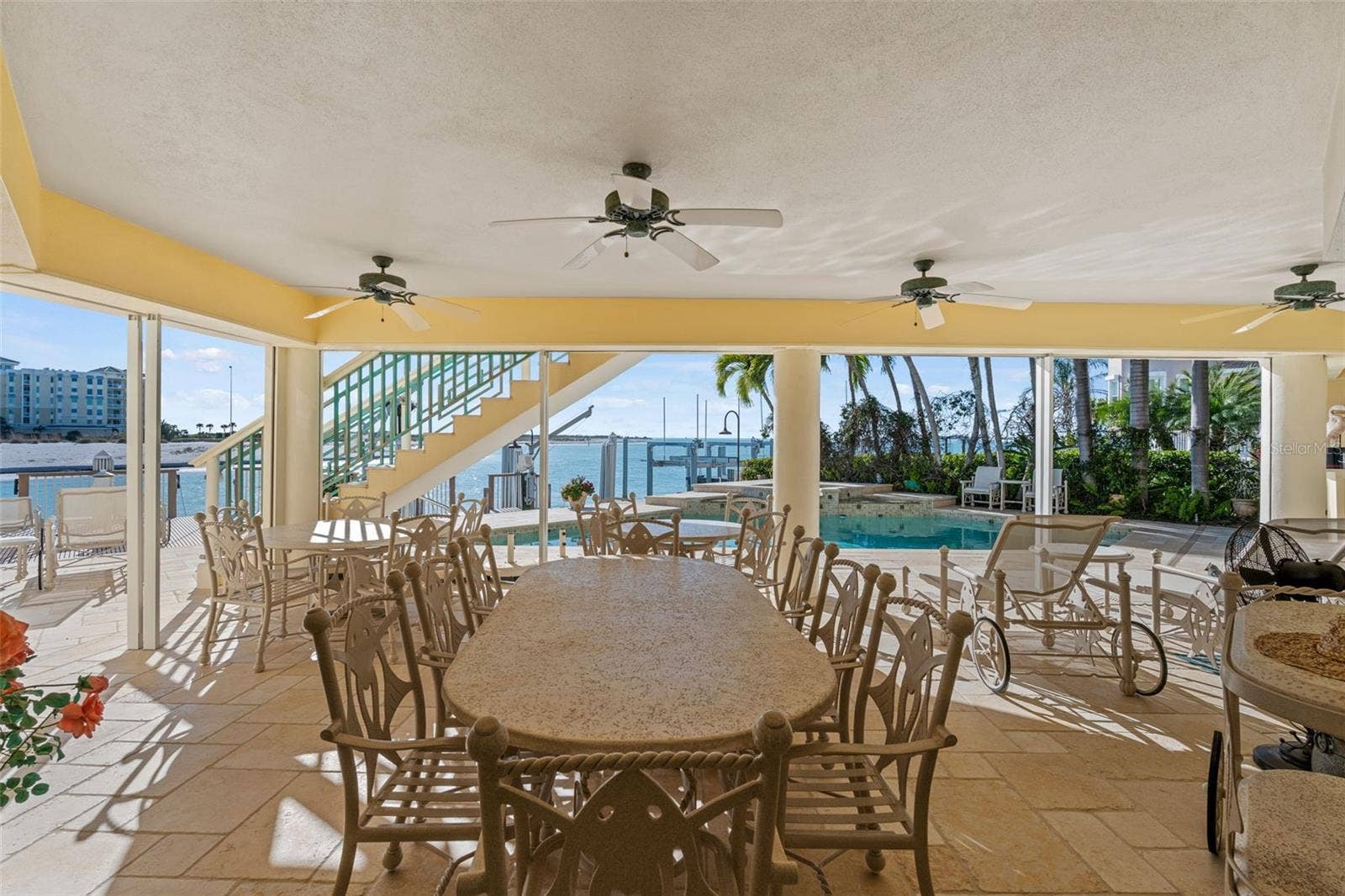 964 MONTE CRISTO BOULEVARD, Tierra Verde, FL 33715 Large Covered Lanai has Hurricane Panels to protect outdoor furniture.