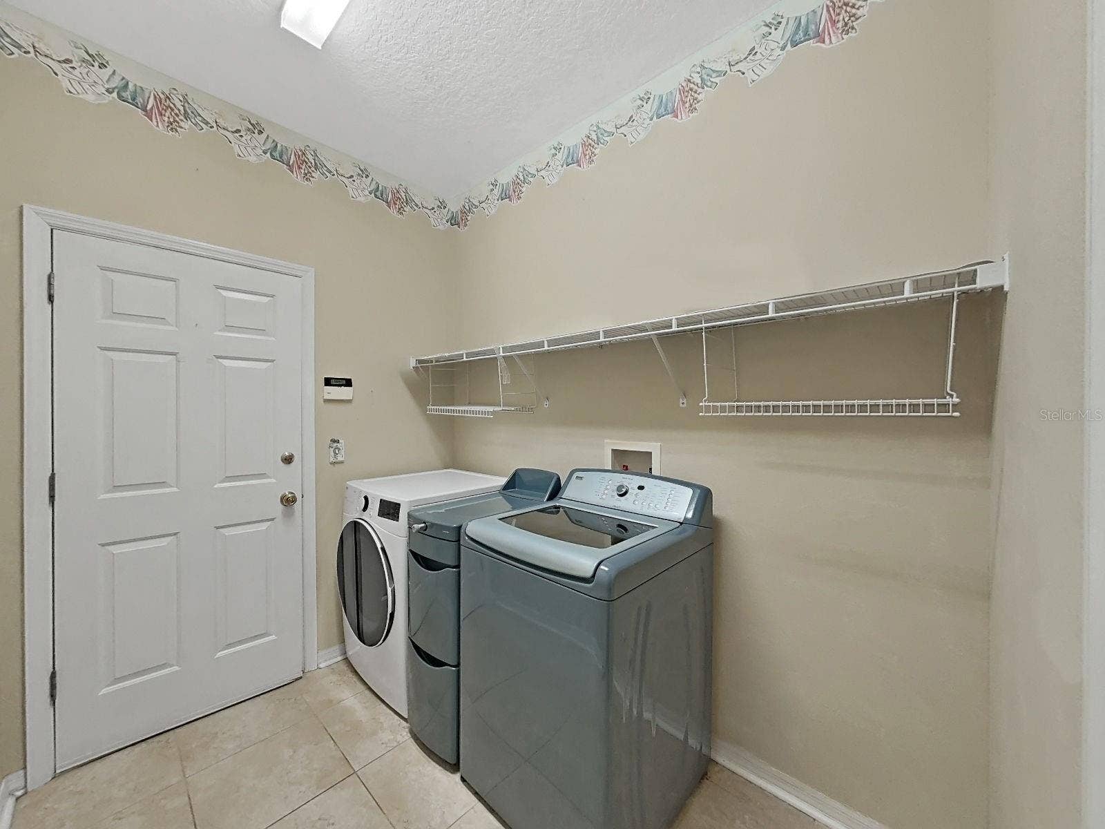 14915 DEVONSHIRE WOODS PLACE, Tampa, FL 33624 Laundry Room with Storage