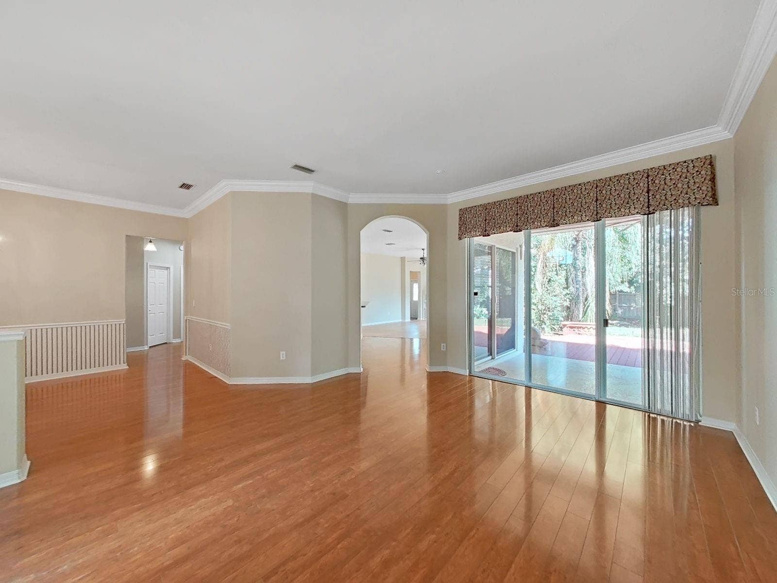 14915 DEVONSHIRE WOODS PLACE, Tampa, FL 33624 View from Living Room into Kitchen/Family Room and Doors to Lanai