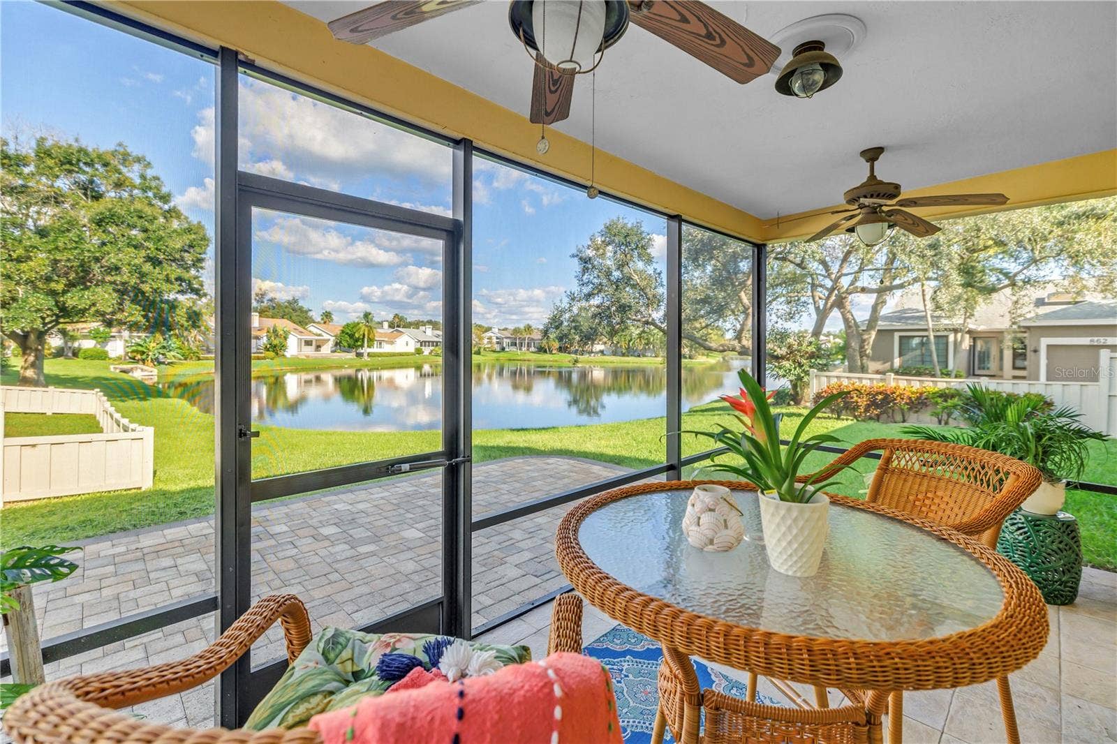 868 GLADES COURT NE, St Petersburg, FL 33702 This covered, screened patio provides an ideal setting for enjoying scenic lake views and local wildlife, whether you are relaxing with a beverage or entertaining guests.