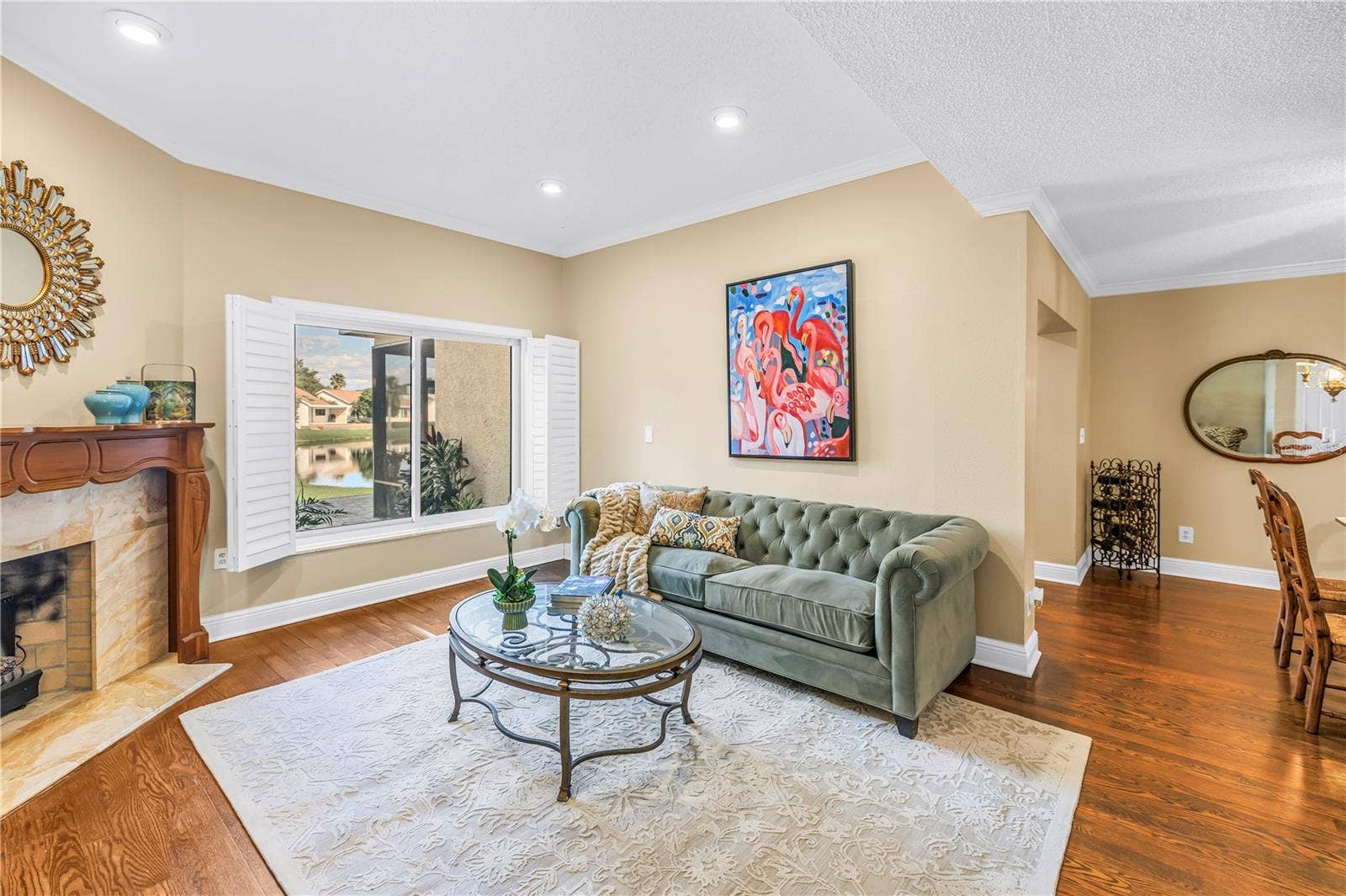 868 GLADES COURT NE, St Petersburg, FL 33702 Formal living area featuring a wood-burning fireplace with an optional insert.