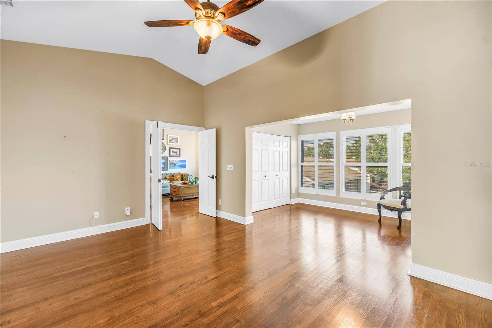 868 GLADES COURT NE, St Petersburg, FL 33702 This secondary view showcases the primary suite and adjacent bonus area, highlighting the luxury French door entrance.