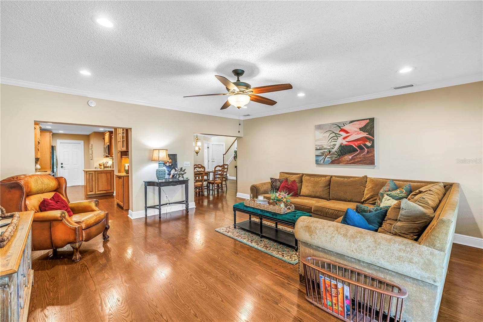 868 GLADES COURT NE, St Petersburg, FL 33702 Spacious bonus family room (17x18) designed for effortless entertaining, featuring hurricane-rated sliders that offer seamless access to the screened porch and raised back patio.