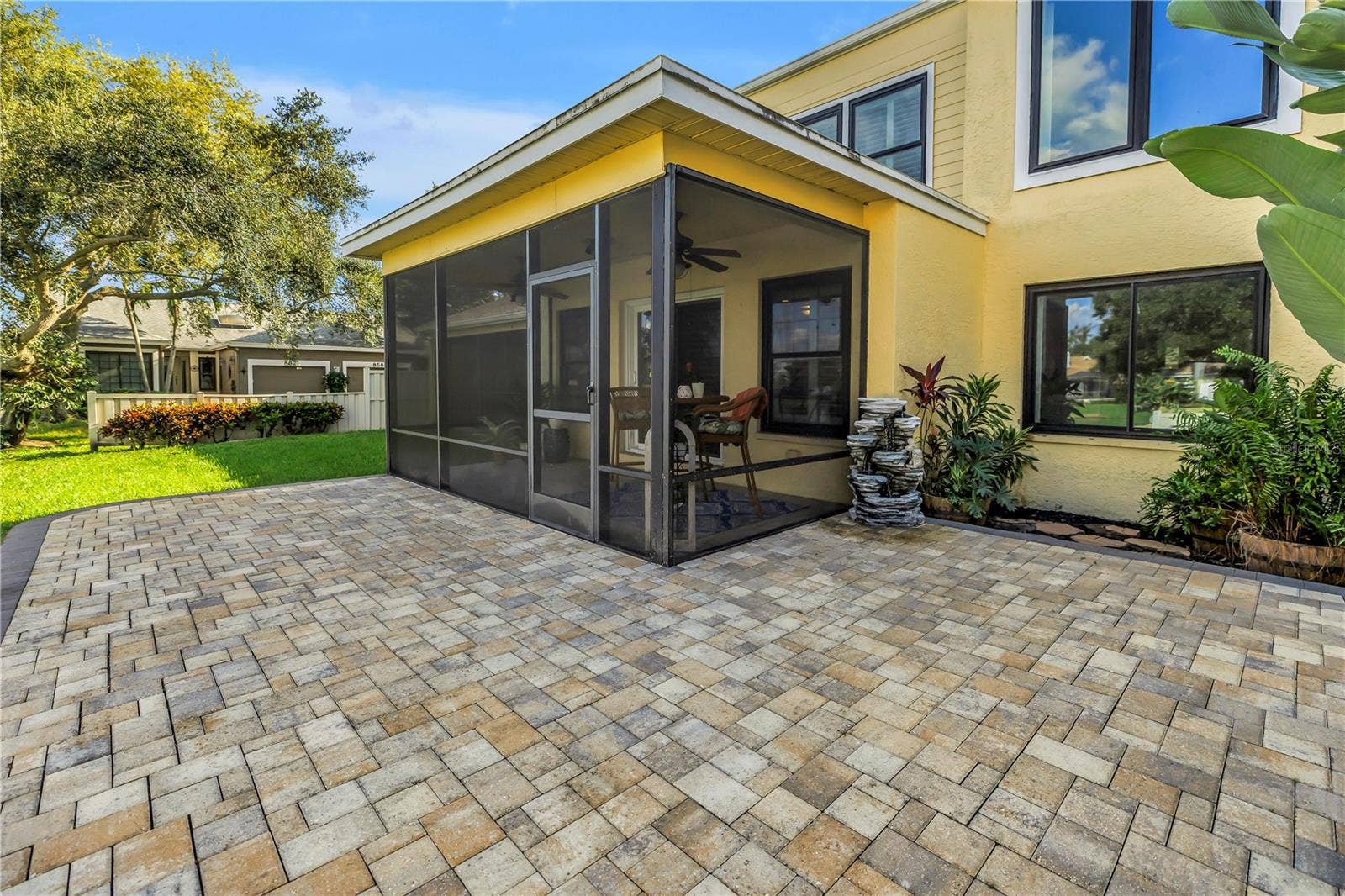 868 GLADES COURT NE, St Petersburg, FL 33702 This screened, covered patio features a raised paver deck, providing an ideal space for an outdoor kitchen or grill. Adirondacks ?!