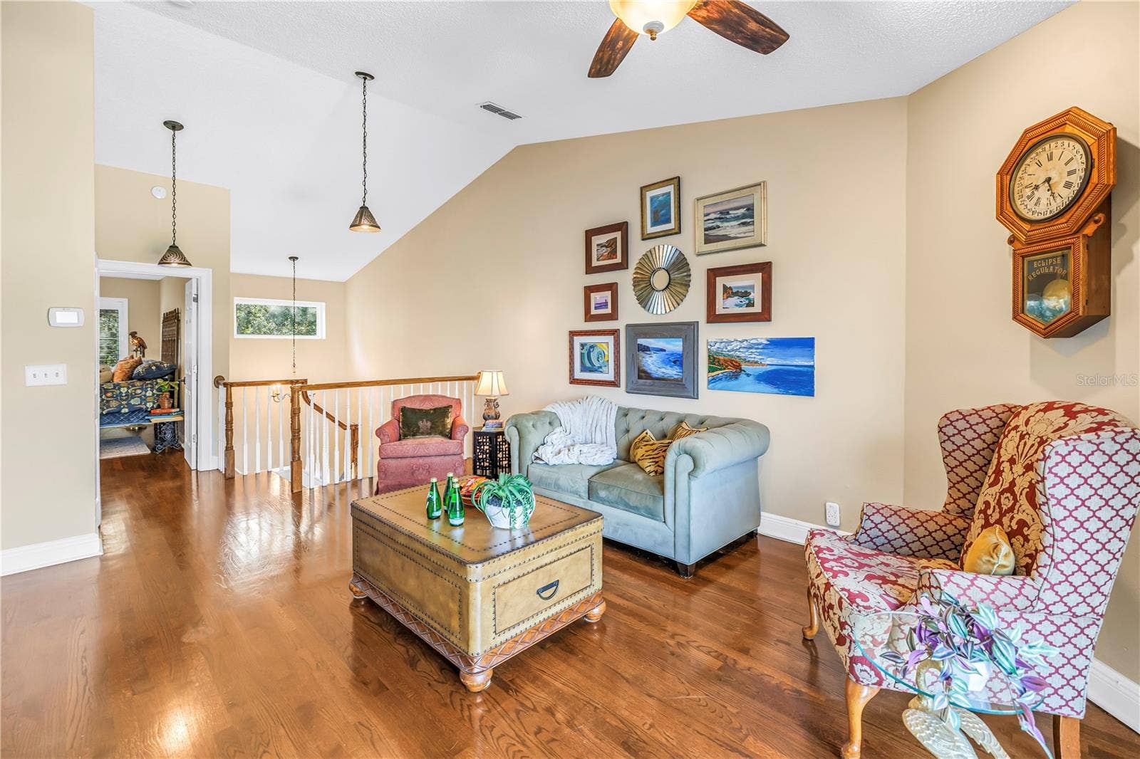868 GLADES COURT NE, St Petersburg, FL 33702 The upstairs bonus space features an open, vaulted ceiling, accessible via a custom-crafted staircase.