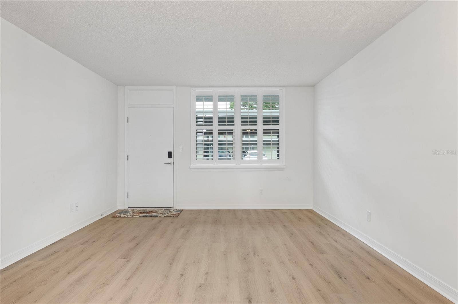 4895 BAY STREET NE, #109, St Petersburg, FL 33703 LIVING ROOM FROM DINING