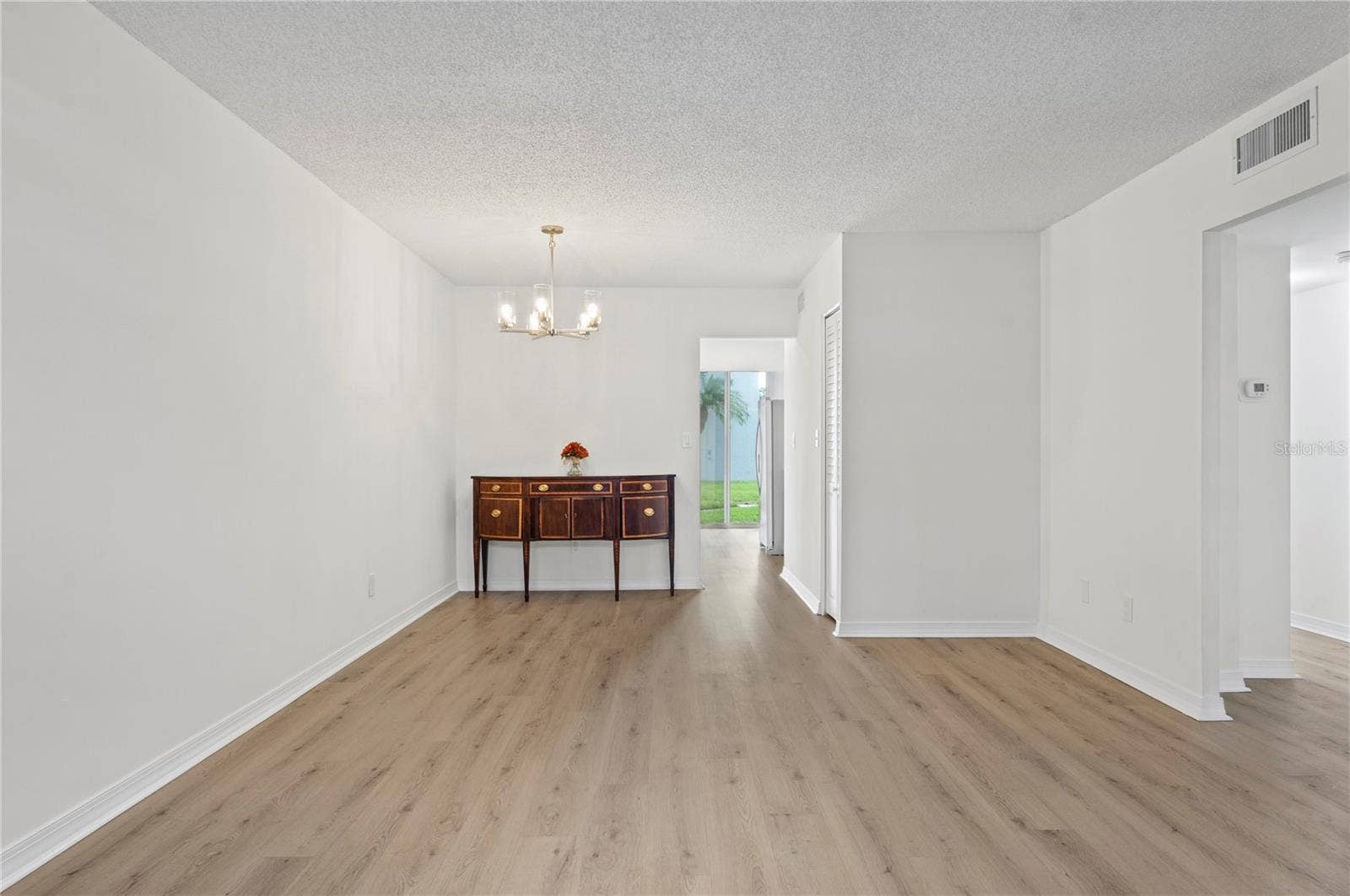 4895 BAY STREET NE, #109, St Petersburg, FL 33703 LIVING/DININGFRONT OF UNIT