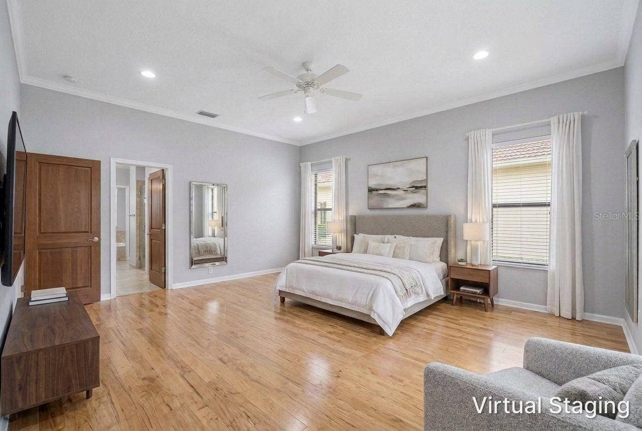 1186 GASPARILLA DRIVE NE, St Petersburg, FL 33702 Virtual staging and updating of the previous two photos showing recessed lighting, hardwood flooring, new paint and staged furniture