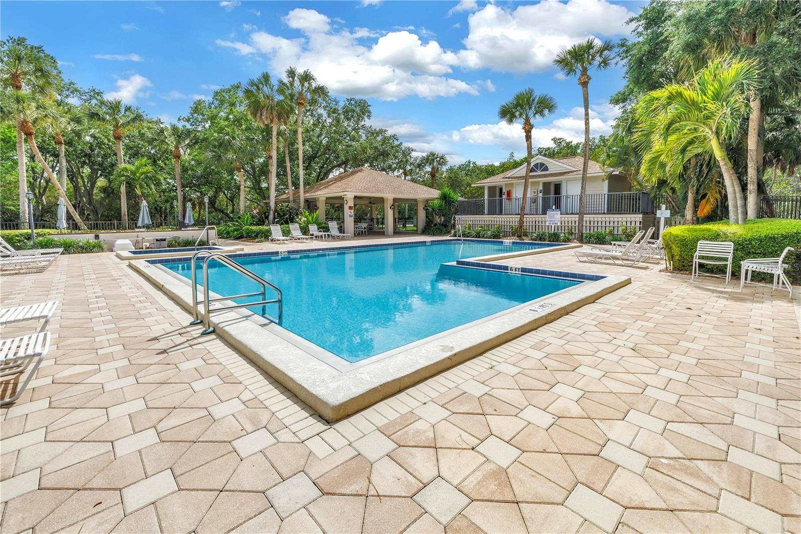 1186 GASPARILLA DRIVE NE, St Petersburg, FL 33702 This image features well-appointed community swimming pool changing rooms and bathroom facilities.