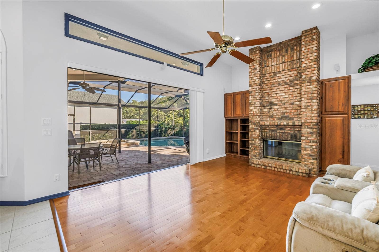 1186 GASPARILLA DRIVE NE, St Petersburg, FL 33702 12 Foot ceilings in this open Great Room with Triple 8-Ft Sliders which pocket and open the inside to the outside. Literally amazing outdoor living. SEE VIRTUAL RENDERING IN PHOTO 58