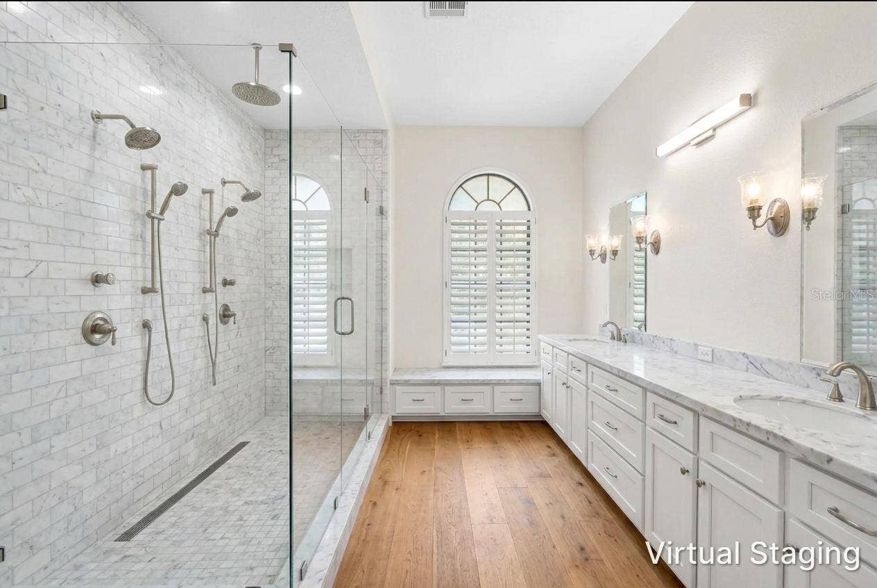 1186 GASPARILLA DRIVE NE, St Petersburg, FL 33702 Virtual update to Primary bath using Previous photo. virtual new vanity, flooring, paint, and shower with glass walls instead of closed walls