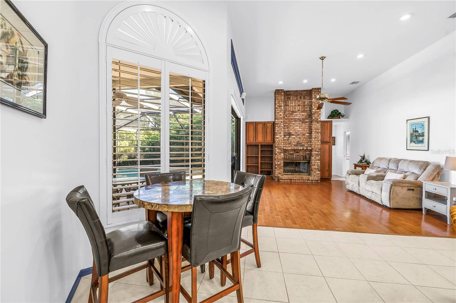 1186 GASPARILLA DRIVE NE, St Petersburg, FL 33702 Breakfast or causal dining area adjacent to the kitchen and great room with views of the pool.