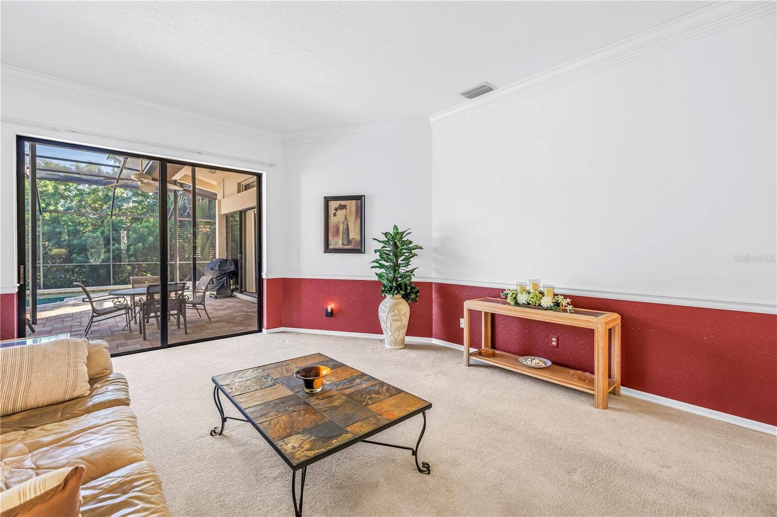 1186 GASPARILLA DRIVE NE, St Petersburg, FL 33702 Crown molding and chair rail accent the 10-foot ceilings, creating a warm and welcoming entry to the home.