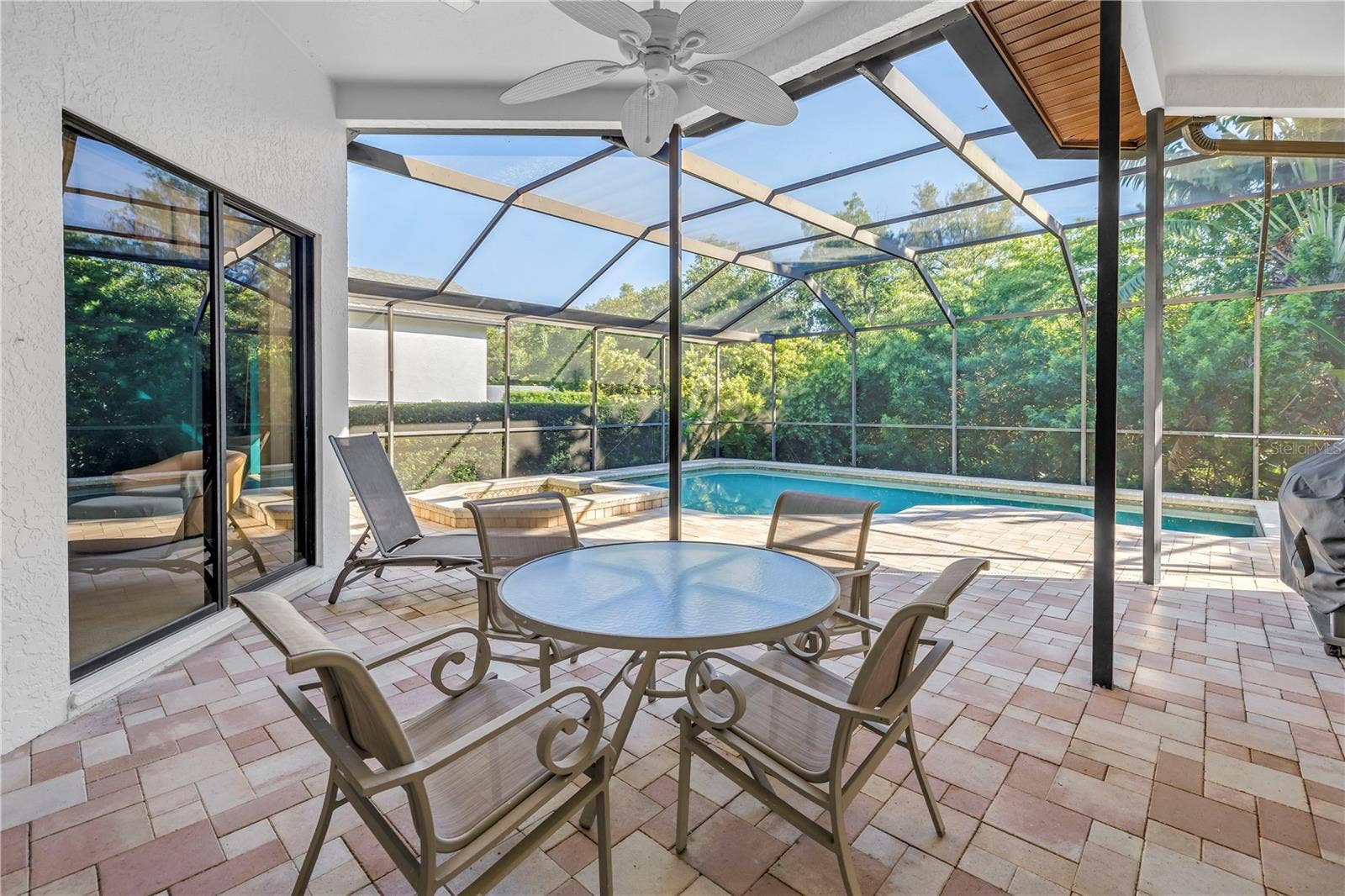 1186 GASPARILLA DRIVE NE, St Petersburg, FL 33702 Featuring a fully covered outdoor living area and a private backyard perfect for entertaining.