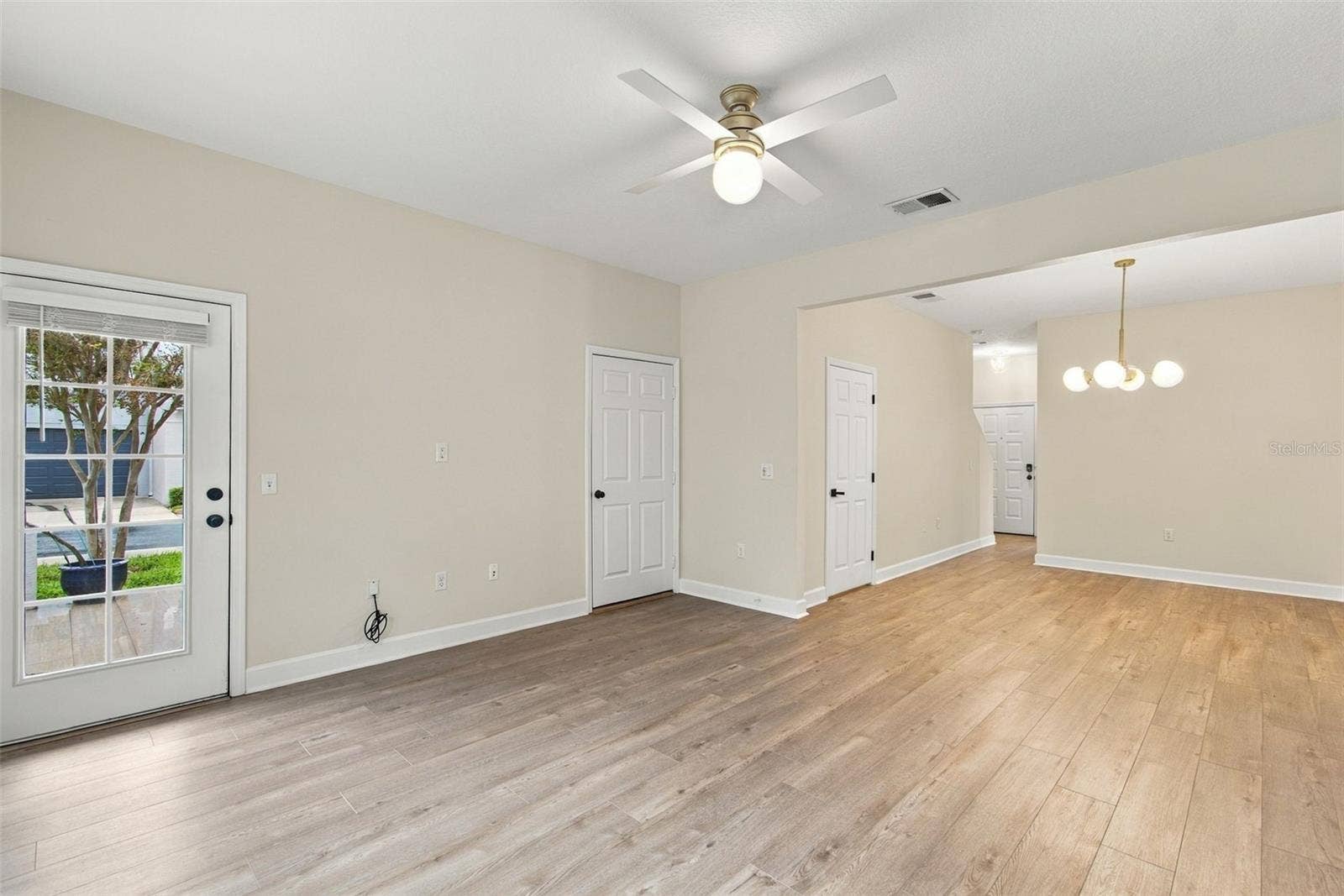 5303 POINT PLEASANT LANE, Tampa, FL 33611 Living Room/Dining Room Combo, with access to Garage & Back Patio