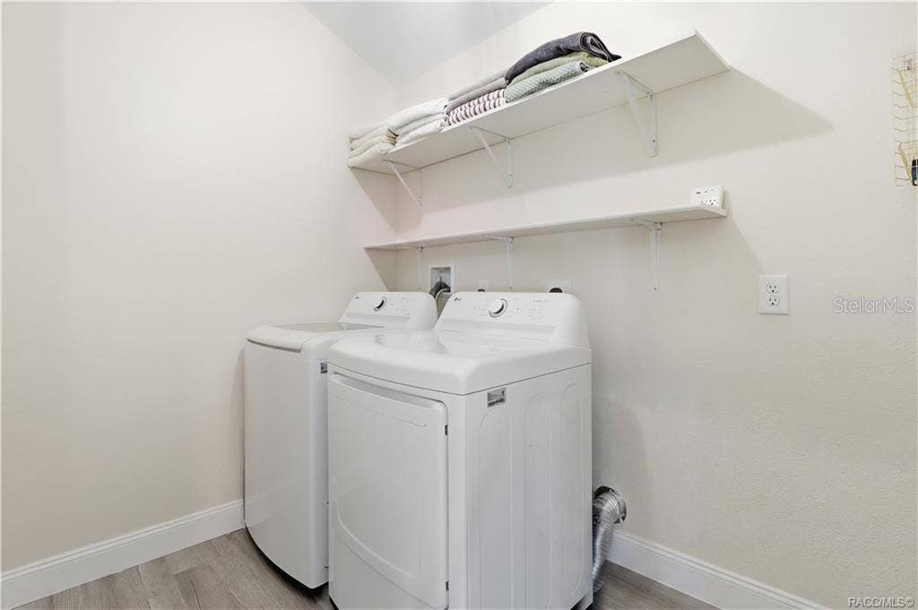 6230 W GLEN ROBBIN COURT, Crystal River, FL 34429 Indoor Laundry Room Convenient INDOOR LAUNDRY featuring a washer, dryer & overhead shelving for additional storage. Everything has its place!