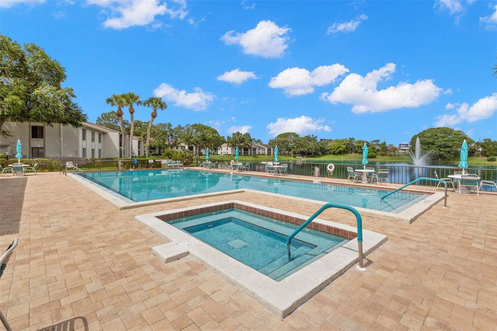 1708 PINE RIDGE WAY E, #B2, Palm Harbor, FL 34684 Heated pool outside of clubhouse