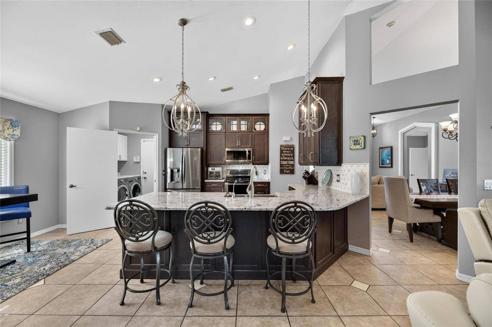 Kitchen showing laundry room