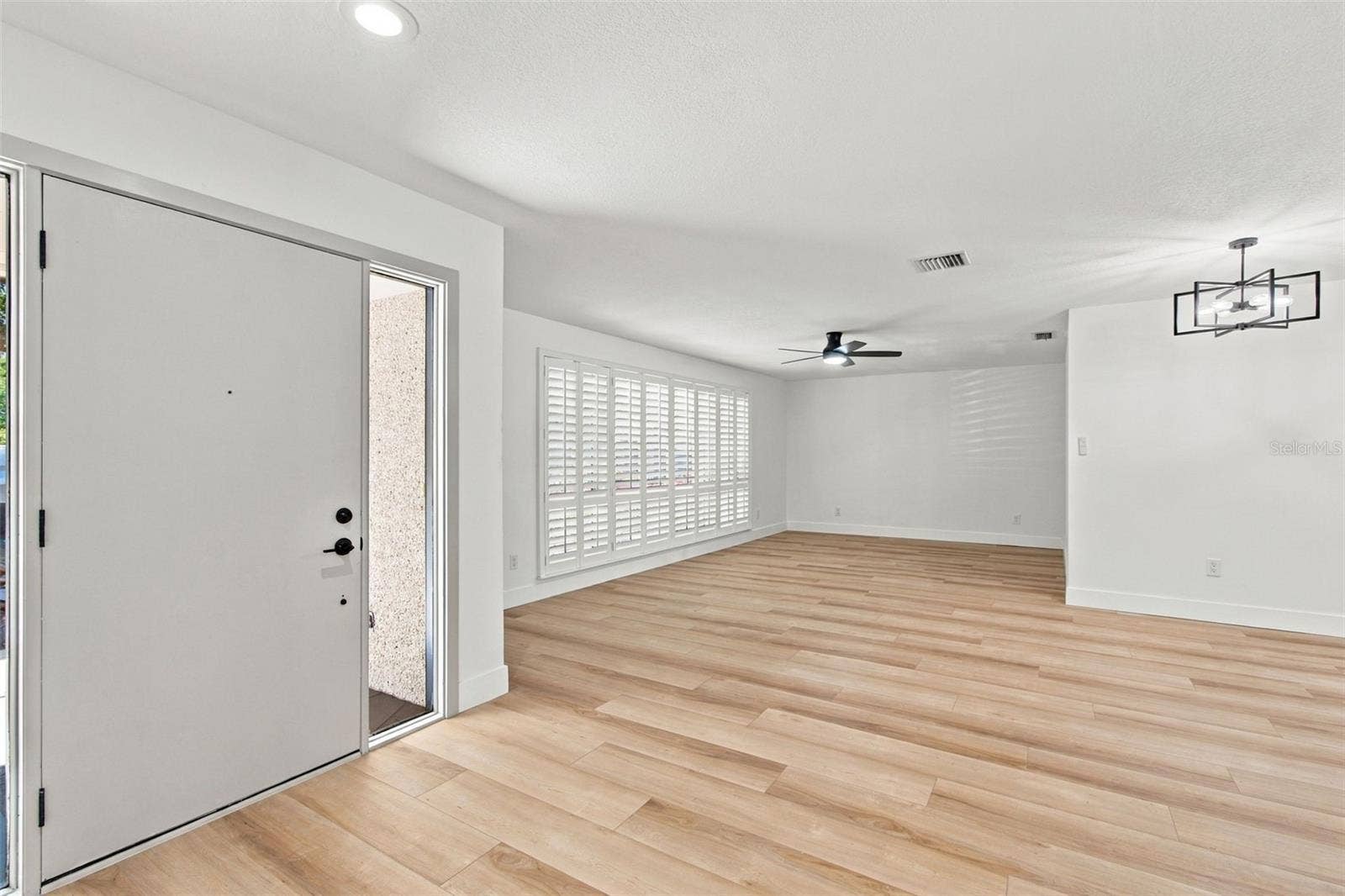 2942 CLUBHOUSE DRIVE W, Clearwater, FL 33761 Front Door, Living Room/ Dining Area