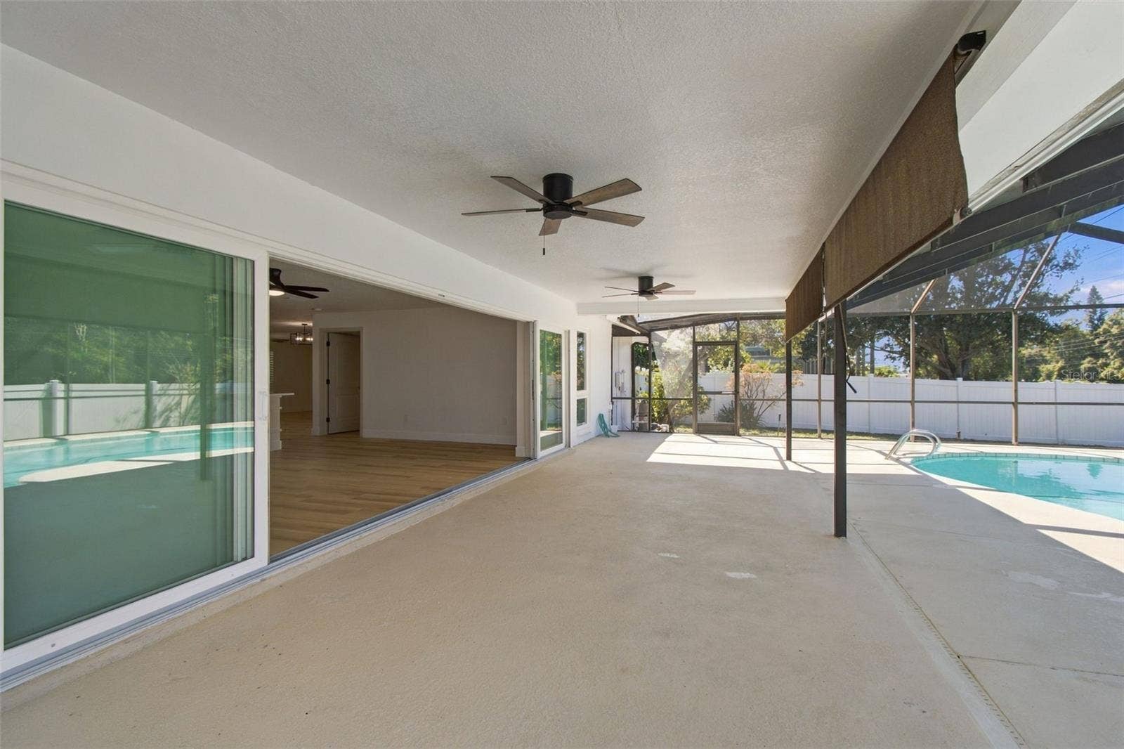 2942 CLUBHOUSE DRIVE W, Clearwater, FL 33761 Pool Patio w/ Sliders open