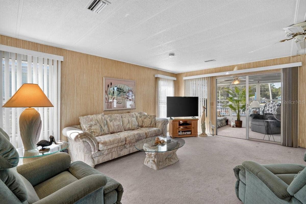 Light and Bright Living Room to Enclosed Porch * Both Living Room and Porch Sofas are Sleeper Sofas