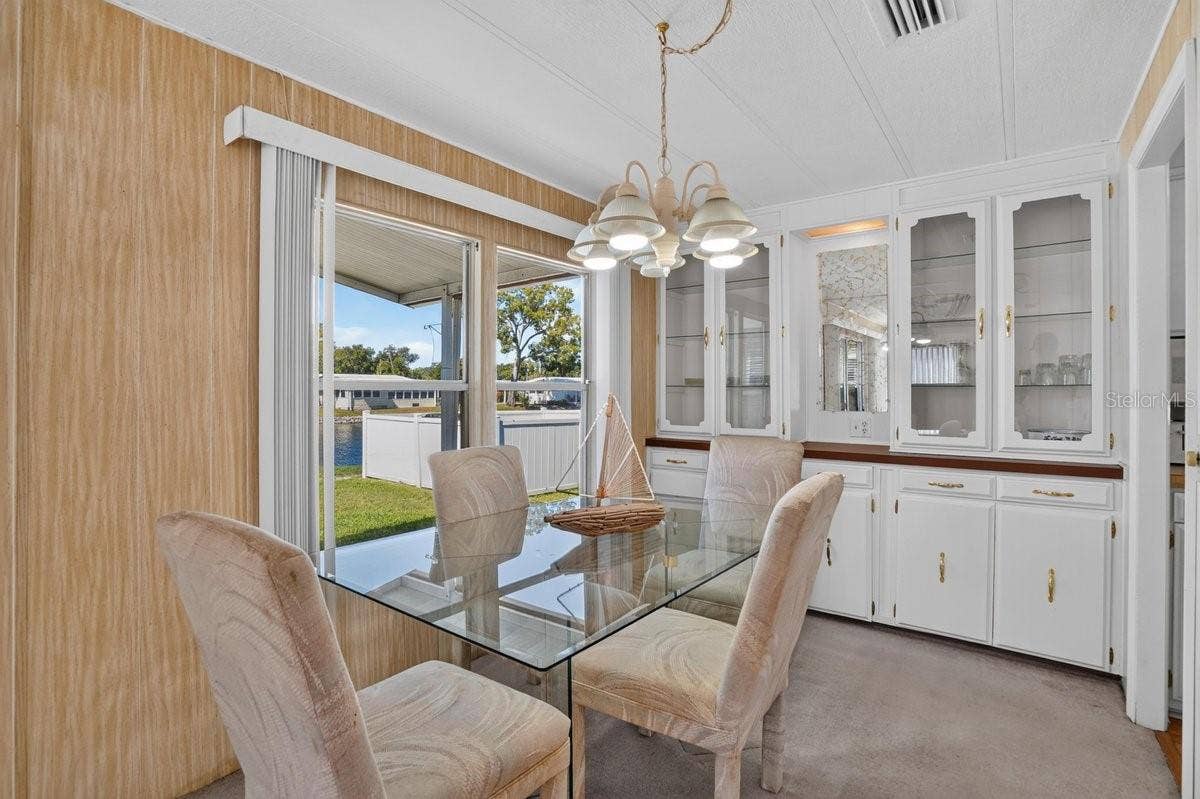 Dining Room with Pond and Pool View * Built In Storage * Just Off the Kitchen