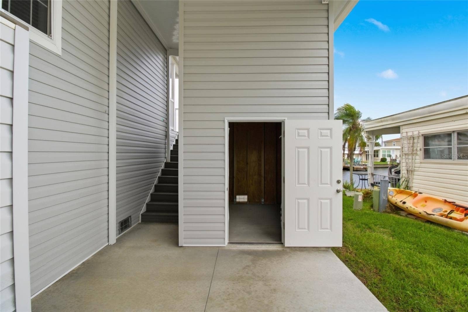 18675 U.S. HIGHWAY 19 N., #349, Clearwater, FL 33764 Large Storage Room- Floor to Ceiling and back staircase to back patio and 2nd entrance