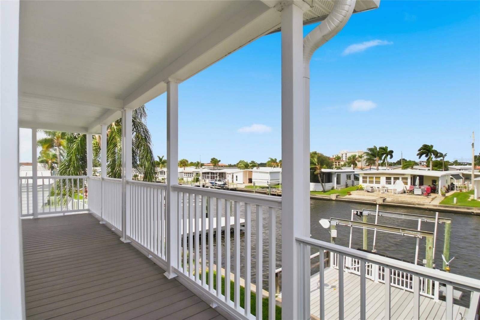 18675 U.S. HIGHWAY 19 N., #349, Clearwater, FL 33764 Expansive waterfront back patio overlooking large boat dock and lift