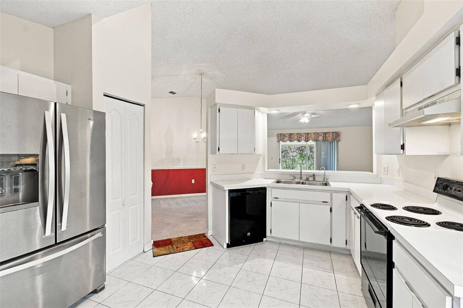 610 LAKEMONT DRIVE, Brandon, FL 33510 Modern kitchen featuring an open-concept layout with a view of the living area.