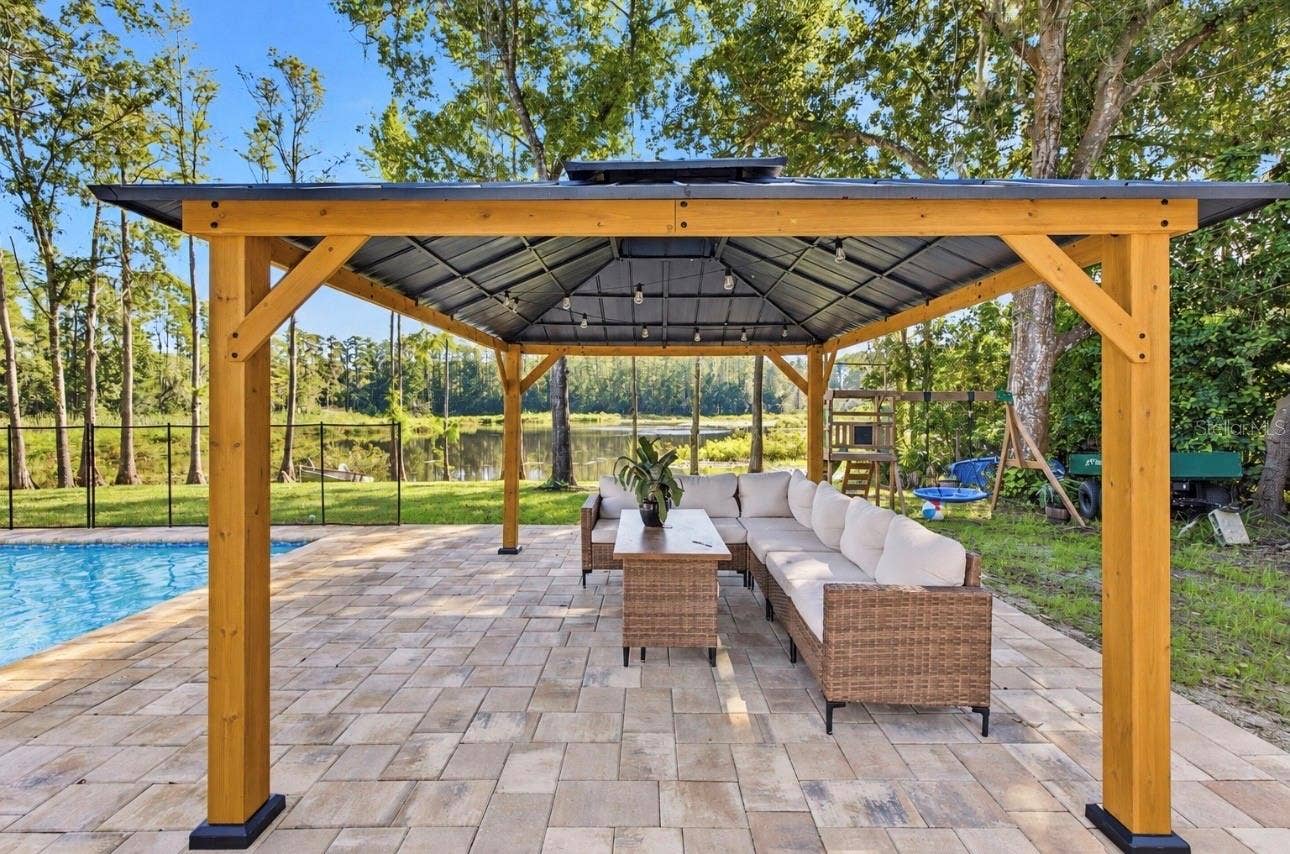2664 WILSKY ROAD, Land O Lakes, FL 34639 Pergola by the pool for hang sessions and eating fully outdoors!