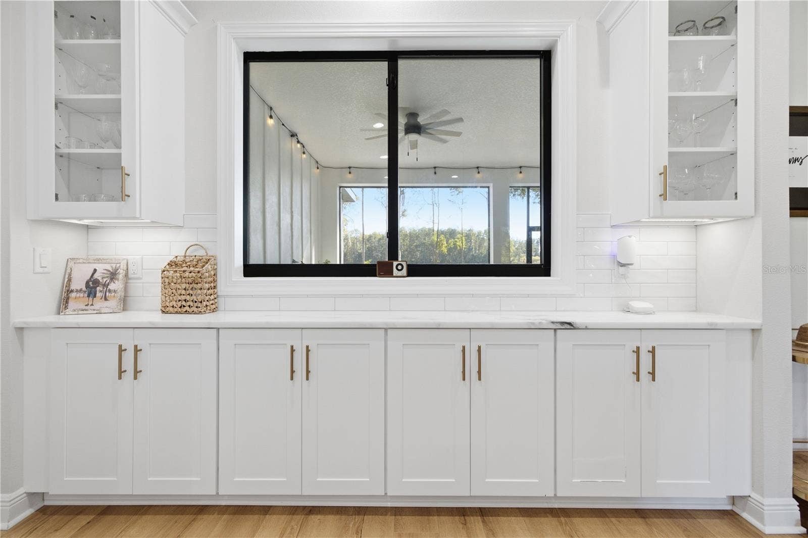 2664 WILSKY ROAD, Land O Lakes, FL 34639 6 FT Pass through window from kitchen to rear porch with 11 FT of custom cabinetry.