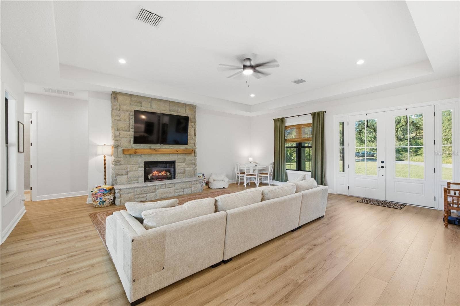 2664 WILSKY ROAD, Land O Lakes, FL 34639 Tons of natural lights and stone detailed electric fireplace.