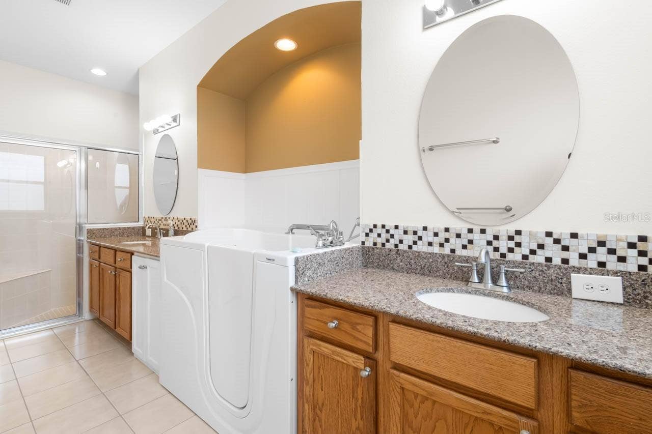 Dual sinks, shower and tub in the Master bath